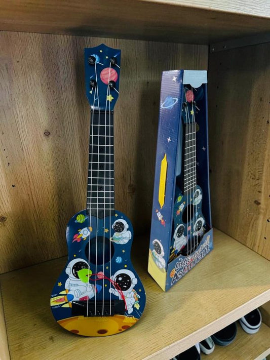 UKULELE EN CAJA ASTRONAUTA